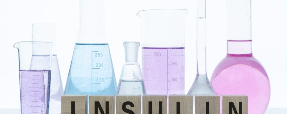 Glass utensils of a lab with the word insulin in front